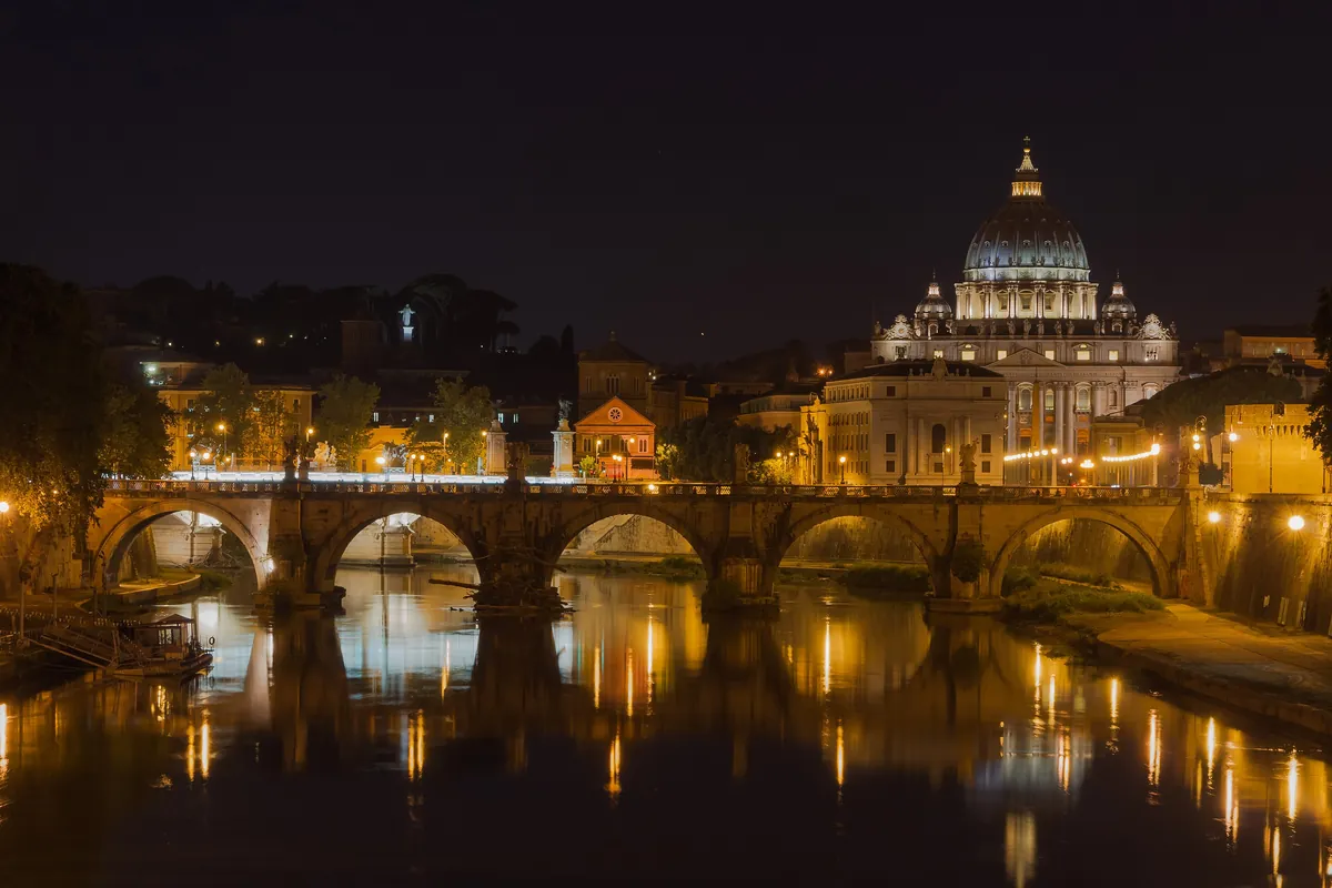 St Peter's Basilica and the Ponte Sant'Angelo in Rome at night